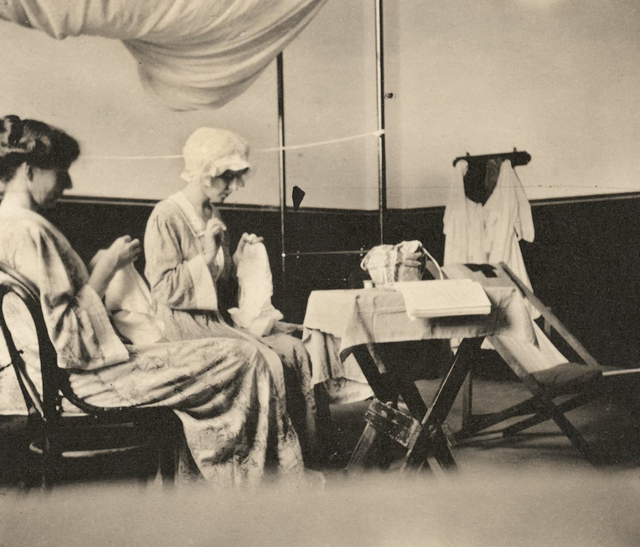 Nurse Mary Mackenzie Finlay and Marjorie Yuille sewing in Marjorie's room. Source: Australian War Memorial, P09381.004.
