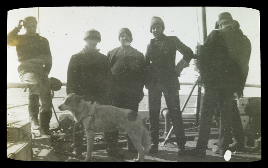 Group portrait on the deck of the Aurora, c. 1914, featuring expedition members (l-r) Hayward, E. Wild, Joyce, Hooke, Gaze and Spencer-Smith. Glass lantern slide. State Library Victoria.