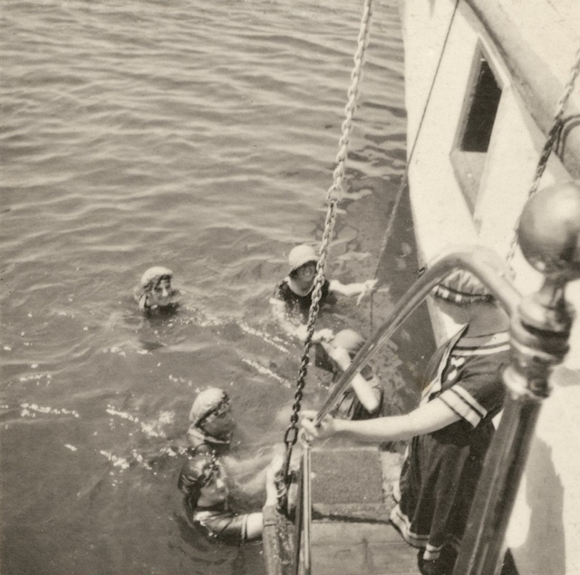 A photo from Marjorie’s collection, showing nurses swimming off the side of a boat.